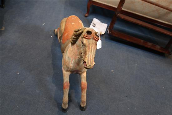 An early 20th century carved and painted wood carousel horse, W.39in. H.27in.